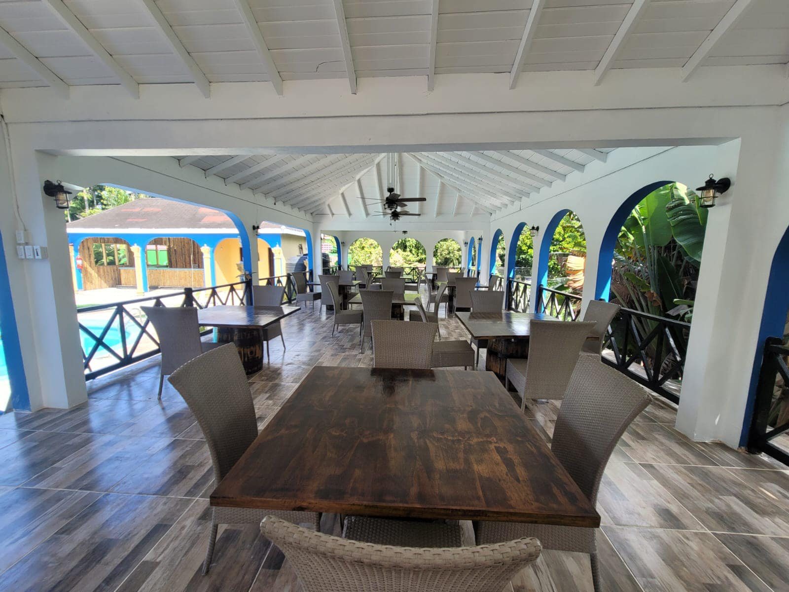 Open-air restaurant overlooking the pool
