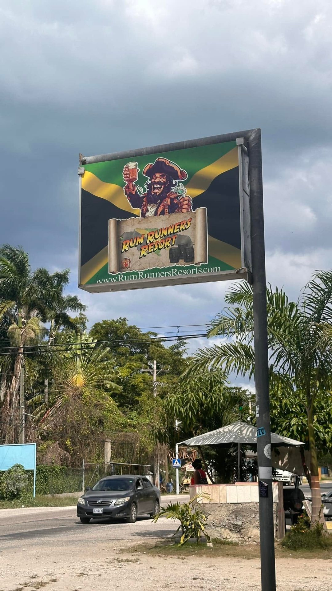 Rum Runners Resort sign on Norman Manley Boulevard